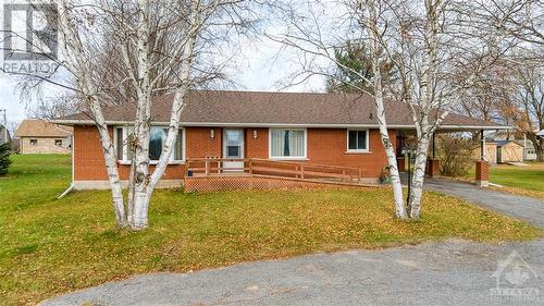 Front of the home, facing onto a large U-shaped driveway - 18144 7 Highway, Perth, ON - Outdoor