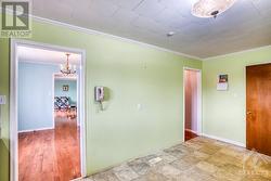 Kitchen - looking towards dining room and hallway at the back - 