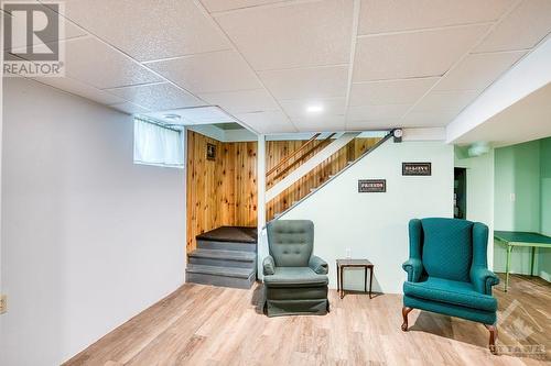 Stairs down to the lower level family room come from the carport entryway - 18144 7 Highway, Perth, ON - Indoor Photo Showing Other Room