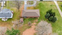 View of the property from above and behind. Large open backyard awaiting your vision - 