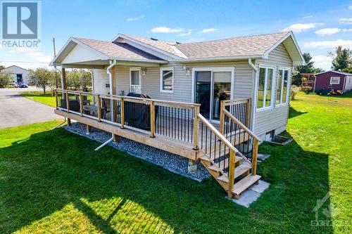 Large entertainment-sized deck has covered area for your BBQ - 2230 Tennyson Road, Perth, ON - Outdoor With Deck Patio Veranda