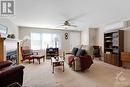 Large window allows natural light to flow through spacious living room - 2230 Tennyson Road, Perth, ON  - Indoor Photo Showing Living Room With Fireplace 