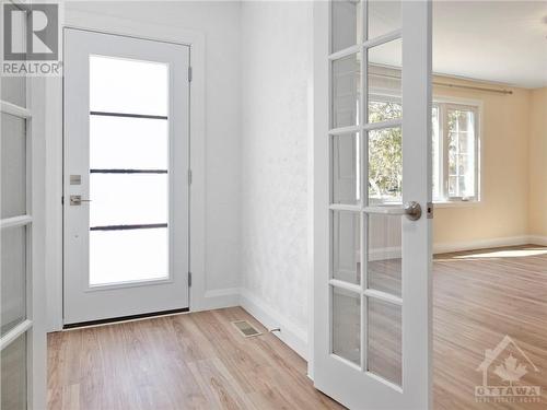 Inviting Foyer w New Main door and elegant French doors. - 1989 Naples Avenue, Ottawa, ON - Indoor Photo Showing Other Room