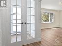 Greeted with French Doors from Foyer to Living. - 1989 Naples Avenue, Ottawa, ON  - Indoor Photo Showing Other Room 