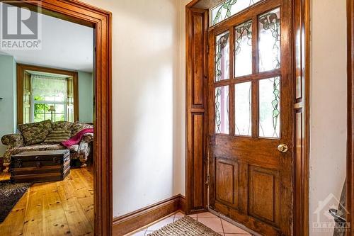 Front door a treaure of solid wood and stained glass - 1731 Beckwith 7Th Line, Carleton Place, ON - Indoor Photo Showing Other Room