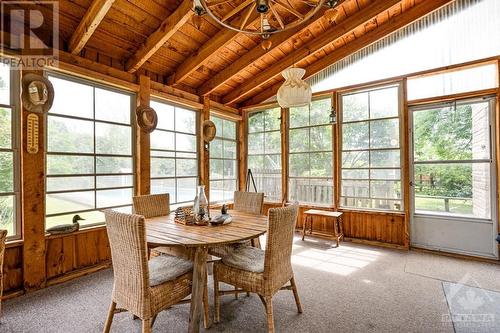 Three-season sunroom has door to tiered deck - 1731 Beckwith 7Th Line, Carleton Place, ON - Indoor Photo Showing Dining Room