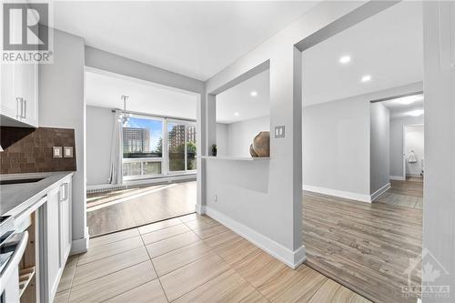 Breakfast bar seating and open space to host and serve friends & family! - 1505 Baseline Road Unit#511, Ottawa, ON - Indoor Photo Showing Kitchen With Upgraded Kitchen