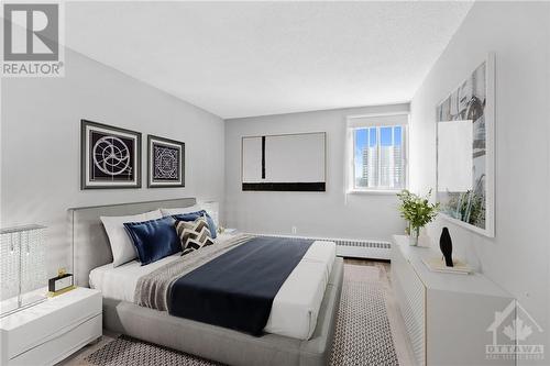 Bedroom w/ window * Closet. (Virtually staged) - 1505 Baseline Road Unit#511, Ottawa, ON - Indoor Photo Showing Bedroom