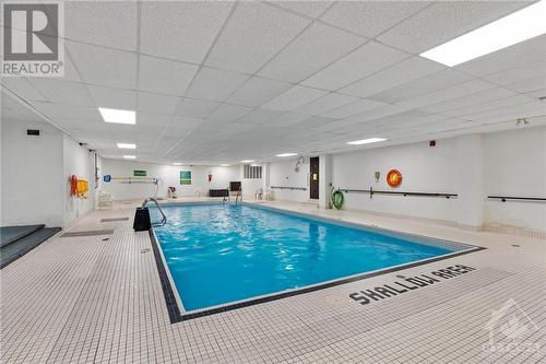 Indoor pool to get laps in during the winter season! - 1505 Baseline Road Unit#511, Ottawa, ON - Indoor Photo Showing Other Room With In Ground Pool