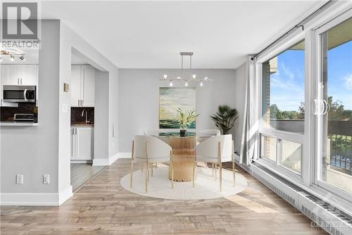 Dining room w/ Brand New light fixture above! (Virtually staged) - 1505 Baseline Road Unit#511, Ottawa, ON - Indoor