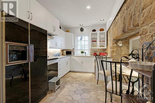 Delightful, light-filled kitchen with breakfast nook - 5B Lewis Street, Perth, ON - Indoor Photo Showing Kitchen