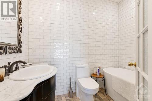 Primary suite ensuite with marble vanity, heated towel warmers and radiant floor heating - 5B Lewis Street, Perth, ON - Indoor Photo Showing Bathroom