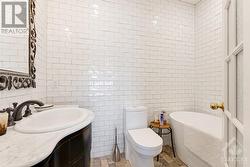 Primary suite ensuite with marble vanity, heated towel warmers and radiant floor heating - 