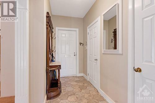 This luxurious townhome has welcoming foyer featuring walk-in closet and honeycomb ceramic floors - 5B Lewis Street, Perth, ON - Indoor Photo Showing Other Room