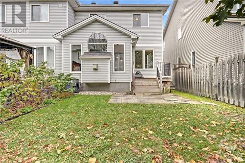 A patio door that opens to a fully fenced backyard with a beautiful interlock patio-an ideal space for relaxation and entertaining. - 17 Coleridge Street, Ottawa, ON - Outdoor