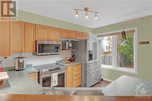 The kitchen, complete with ample cabinetry and sleek, premium stainless steel appliances - 17 Coleridge Street, Ottawa, ON - Indoor Photo Showing Kitchen