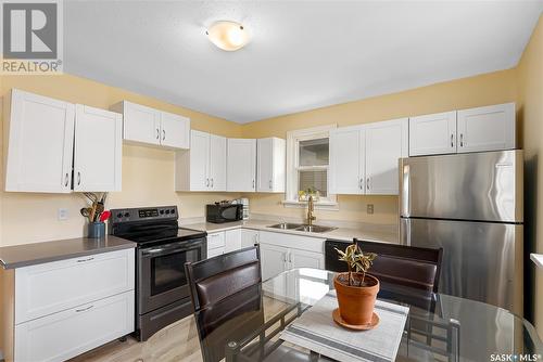 908 L Avenue S, Saskatoon, SK - Indoor Photo Showing Kitchen With Double Sink