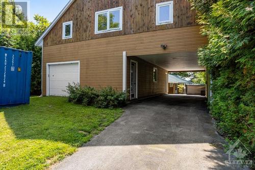 Detached insulated 125 amp garage-workshop has attached double carport - 193 Pretties Island Road, Carleton Place, ON - Outdoor With Exterior