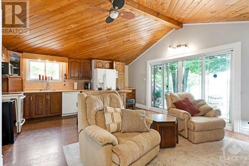 Open living, dining and kitchen with two sets of double patio doors for endless views of the lake - 193 Pretties Island Road, Carleton Place, ON - Indoor Photo Showing Other Room