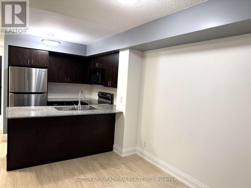 703 - 55 De Boers Drive, Toronto, ON - Indoor Photo Showing Kitchen With Double Sink