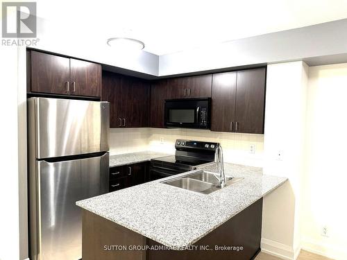 703 - 55 De Boers Drive, Toronto, ON - Indoor Photo Showing Kitchen With Double Sink