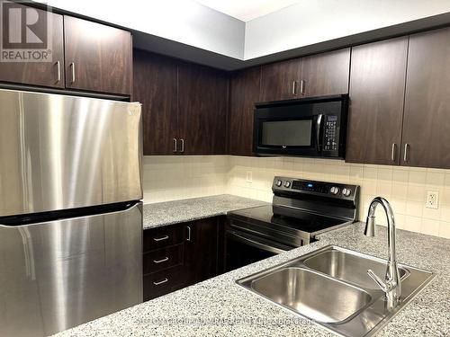 703 - 55 De Boers Drive, Toronto, ON - Indoor Photo Showing Kitchen With Double Sink