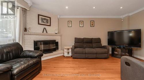 14 Simmons Boulevard, Brampton, ON - Indoor Photo Showing Living Room With Fireplace