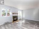 I - 5 Henry Goulburn Way, Ottawa, ON  - Indoor Photo Showing Living Room With Fireplace 