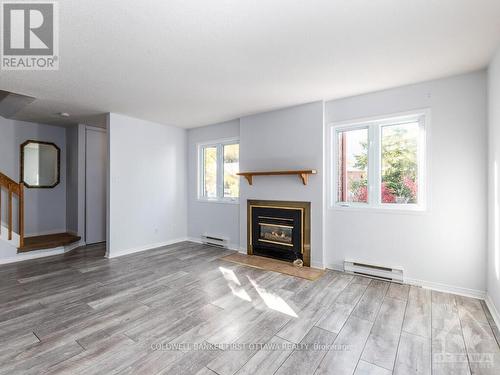 I - 5 Henry Goulburn Way, Ottawa, ON - Indoor Photo Showing Living Room With Fireplace