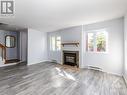 I - 5 Henry Goulburn Way, Ottawa, ON  - Indoor Photo Showing Living Room With Fireplace 