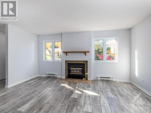 I - 5 Henry Goulburn Way, Ottawa, ON - Indoor Photo Showing Living Room With Fireplace