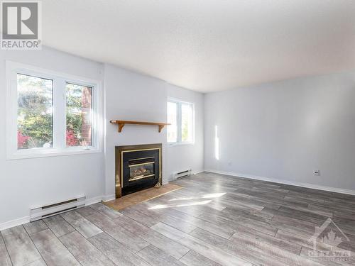 5 Henry Goulburn Way Unit#I, Stittsville, ON - Indoor Photo Showing Living Room With Fireplace