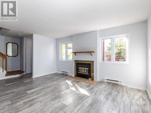 5 Henry Goulburn Way Unit#I, Stittsville, ON - Indoor Photo Showing Living Room With Fireplace