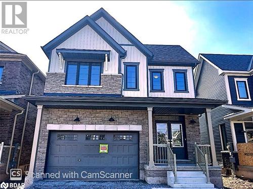 View of front of house featuring a porch and a garage - 113 Stern Drive, Welland, ON - Outdoor With Facade