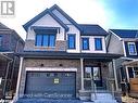 View of front of house featuring a porch and a garage - 113 Stern Drive, Welland, ON  - Outdoor With Facade 