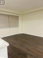 Spare room with dark hardwood / wood-style floors - 