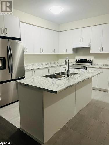 Kitchen with white cabinetry, an island with sink, and stainless steel appliances - 113 Stern Drive, Welland, ON - Indoor Photo Showing Kitchen With Double Sink With Upgraded Kitchen