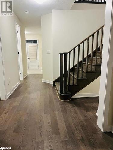 Hall with a textured ceiling and dark hardwood / wood-style flooring - 113 Stern Drive, Welland, ON - Indoor Photo Showing Other Room