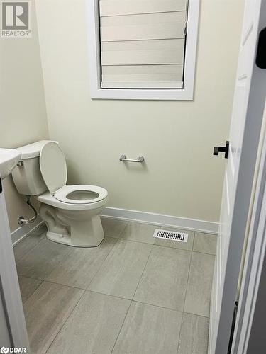 Bathroom with tile patterned floors and toilet - 113 Stern Drive, Welland, ON - Indoor Photo Showing Bathroom