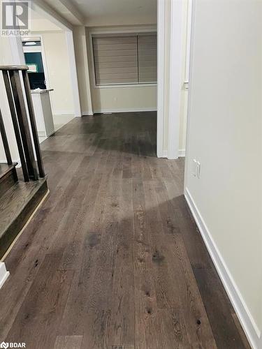 Hall featuring dark wood-type flooring - 113 Stern Drive, Welland, ON - Indoor Photo Showing Other Room