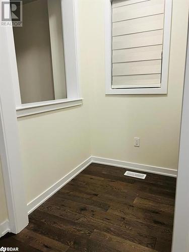 Spare room featuring dark wood-type flooring - 113 Stern Drive, Welland, ON - Indoor Photo Showing Other Room