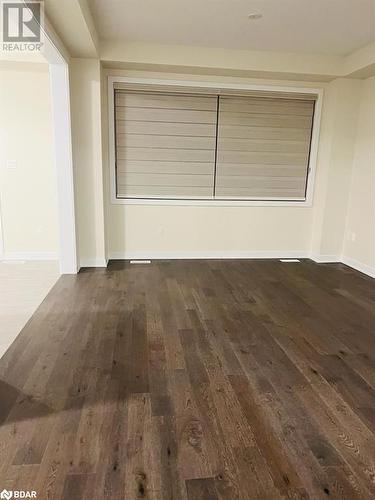 Empty room with dark hardwood / wood-style flooring - 113 Stern Drive, Welland, ON - Indoor Photo Showing Other Room