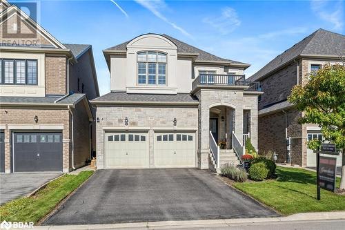 French country style house with a balcony, a front yard, and a garage - 19 Mugford Crescent, Brampton, ON - Outdoor With Facade