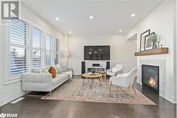 Living room featuring dark hardwood / wood-style flooring - 