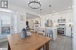 Tiled dining space featuring an inviting chandelier - 