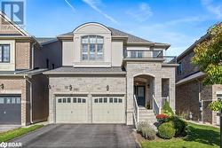 View of front of house with a balcony and a garage - 