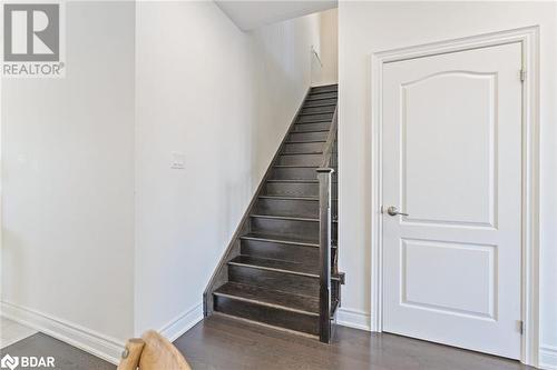 Stairway with hardwood / wood-style floors - 19 Mugford Crescent, Brampton, ON - Indoor Photo Showing Other Room