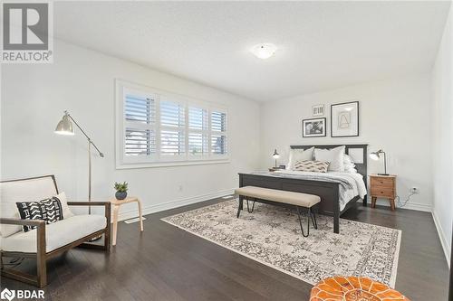 Bedroom featuring dark hardwood / wood-style floors - 19 Mugford Crescent, Brampton, ON - Indoor Photo Showing Bedroom