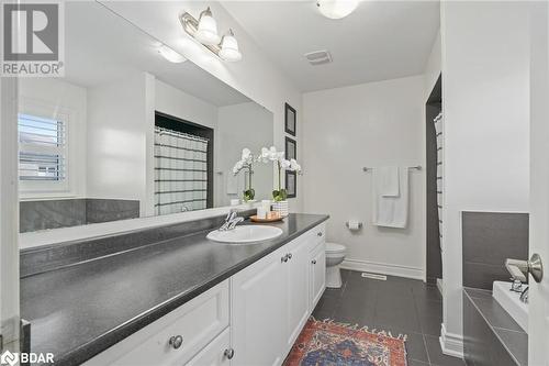 Bathroom featuring toilet, vanity, and tile patterned floors - 19 Mugford Crescent, Brampton, ON - Indoor Photo Showing Bathroom