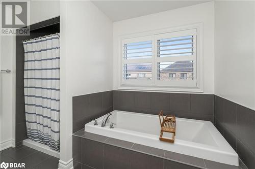 Bathroom with tile patterned flooring and independent shower and bath - 19 Mugford Crescent, Brampton, ON - Indoor Photo Showing Bathroom